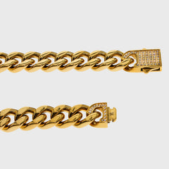 This is a studio product shot of our 10mm yellow gold Cuban link bracelet with the Cubic zirconia clasp being shown