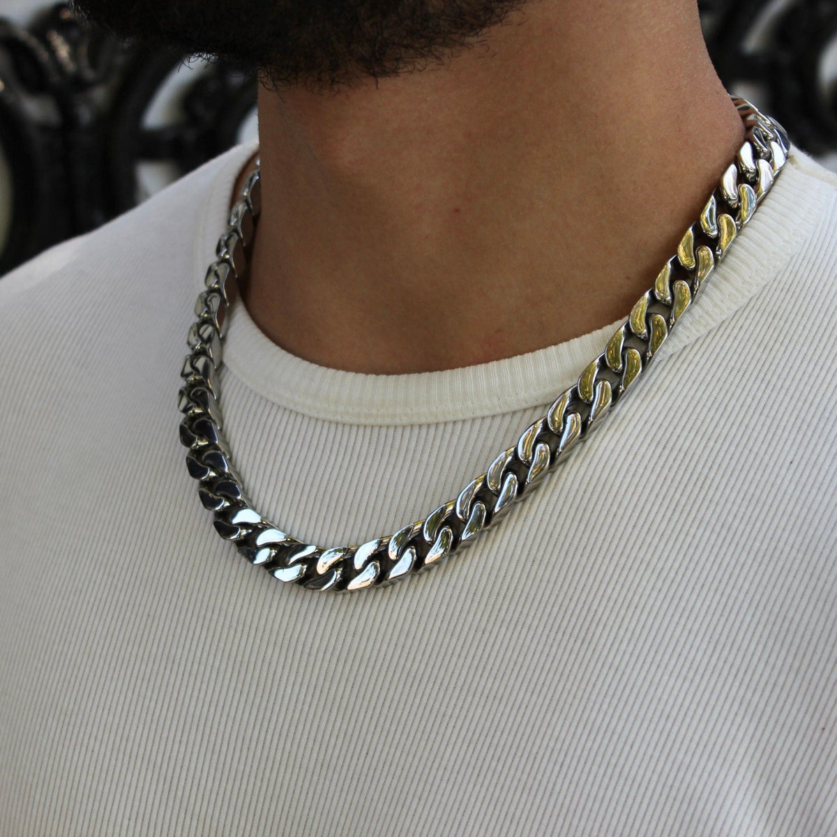 this is a close up side shot of our 12mm miami cuban link chain being displayed on a models neck