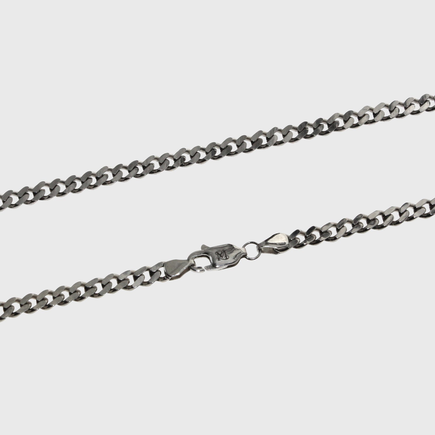 This is a Producrt shot of our 3.5mm sterling silver cuban link chain with the clasp on a plain white backround