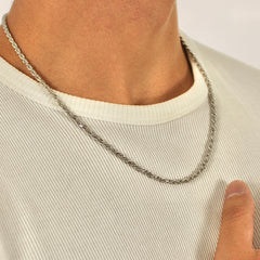 This is a side close up shot of a model wearing our 3mm sterling silver rope chain.