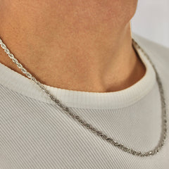 This is an extreme close up shot of our 3mm sterling silver rope chain on our models neck.