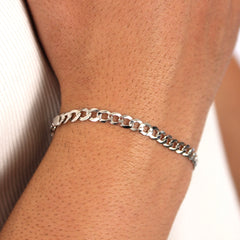 This is an extreme closeup shot of our 5mm sterling silver curb bracelet on a models wrist