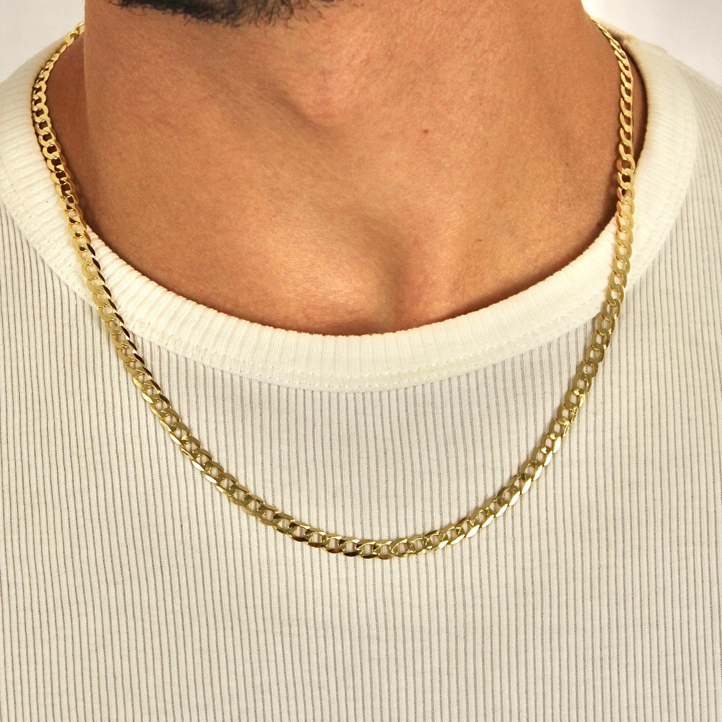 This is a front shot of our 5mm Yellow gold Curb chain on a models neck