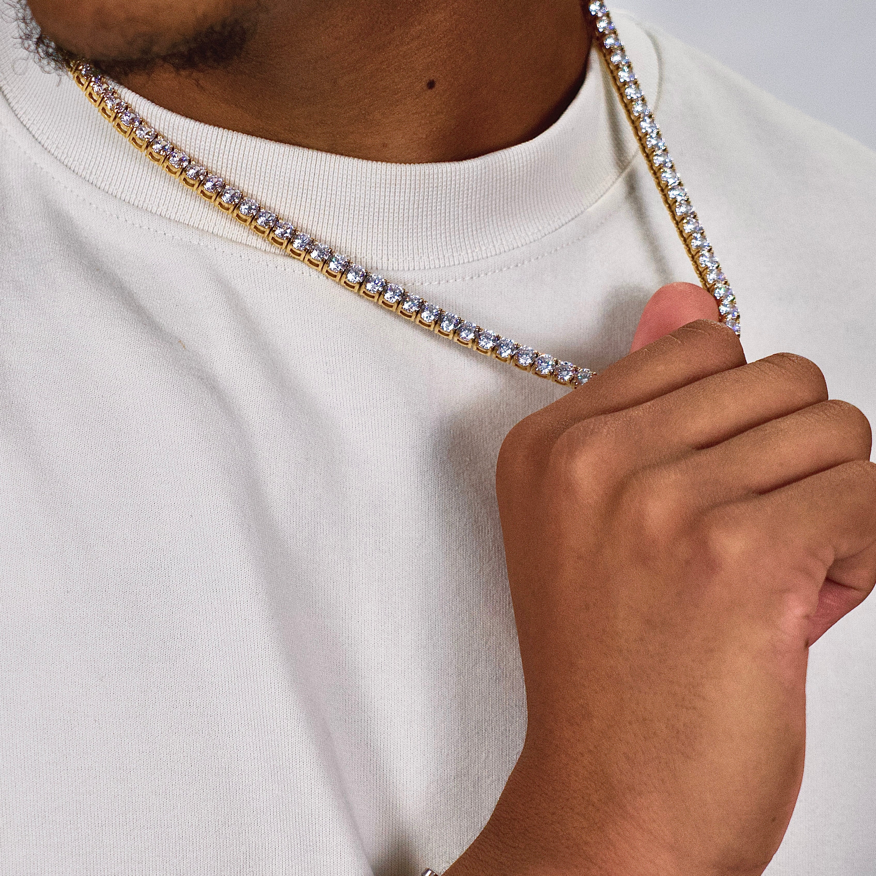 This is a side shot taken in a studio of a model wearing our 5mm Stainless Steel Tennis Necklace