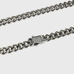 This is a product shot taken in a studio of our 6mm cuban link chain with our cubic zirconia clasp being shown