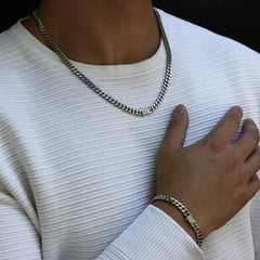 This is a mid shot of our 6mm cuban link chain necklace paired with the matching bracelet in a styling photo