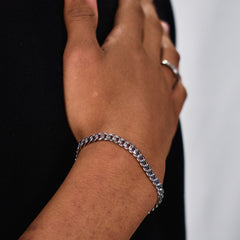 This is a closeup shot of our 6mm cuban link bracelet on a models wrist 