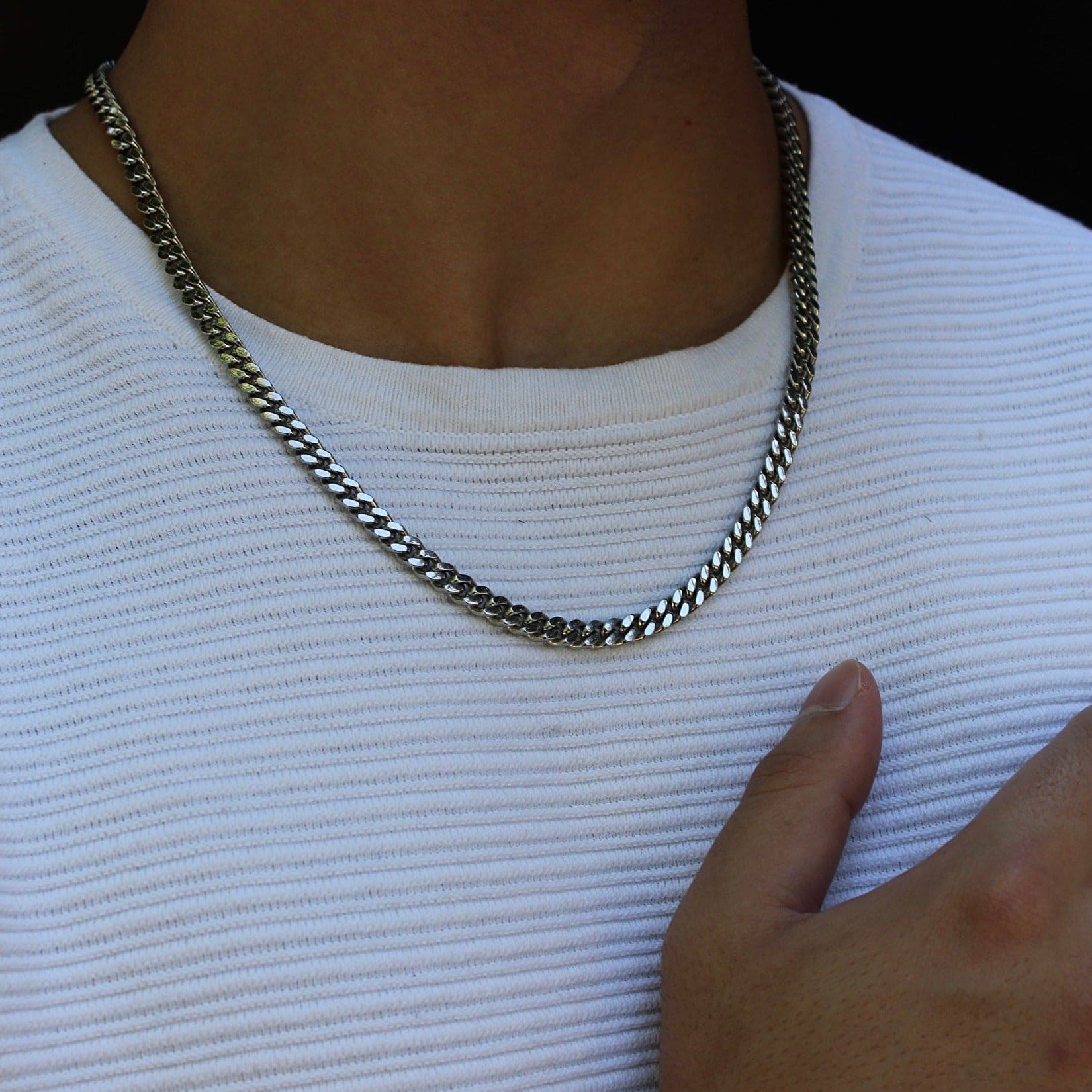 This is an image of our 6mm cuban link chain on our models neck with no clasp being displayed