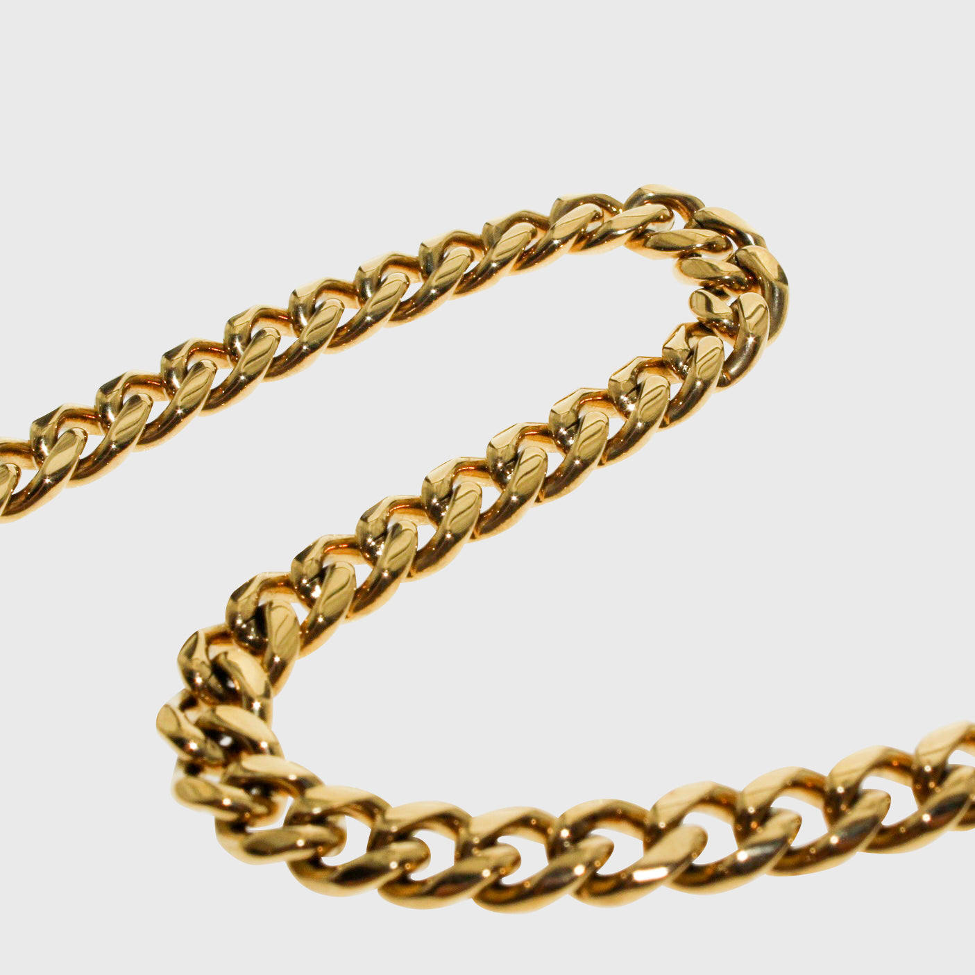 This is a product shot on a white background of our 6mm yellow gold mens cuban link chain