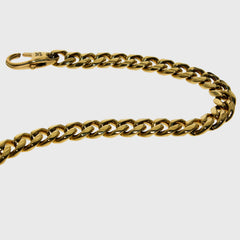 This is a close up product shot of our 6mm yellow gold cuban link bracelet with the lobster clasp being shown