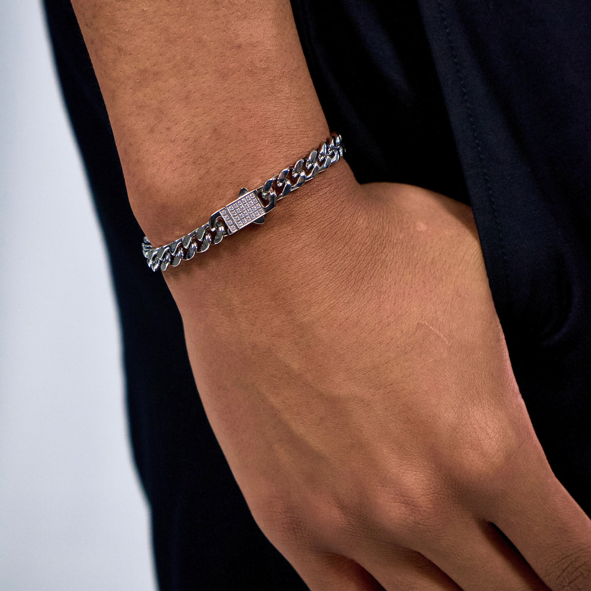 This is a close up shot of our models hand in pocket whilst showcasing our 8mm cuban link bracelet 