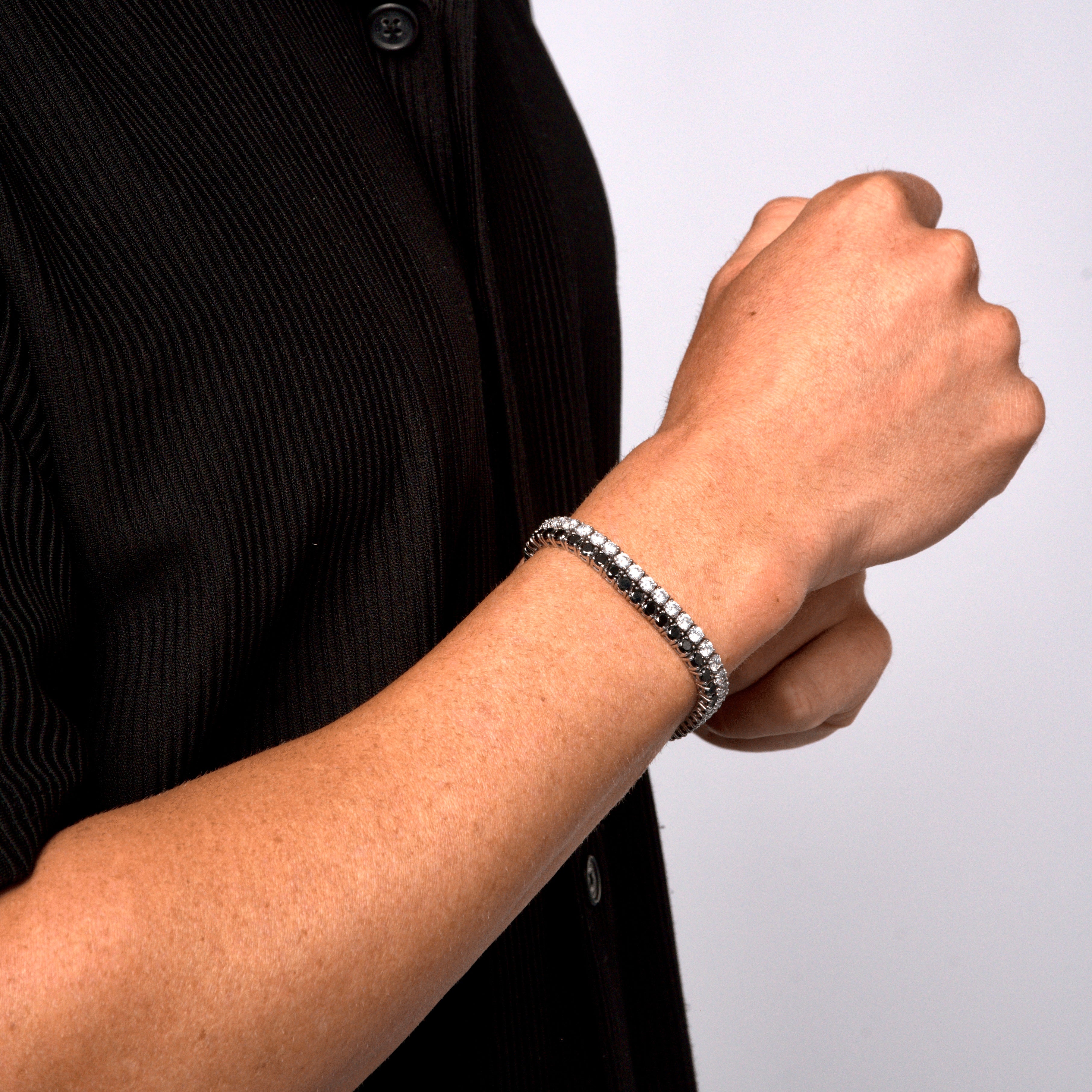 This is a side shot taken in a studio of a models wrist, wearing our 8mm dual white & black tennis bracelet