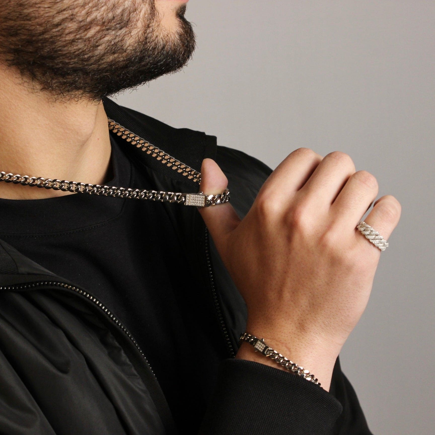 This is a shot of our model pulling the 8mm stainless steel cuban chain with his thumb whilst showing the style of the chain