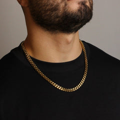 This is a mid shot of our 8mm yellow gold cuban link chain on our models neck