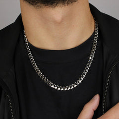 This is a close-up shot of a model wearing our 7mm sterling silver curb link chain, no clasp is being displayed.