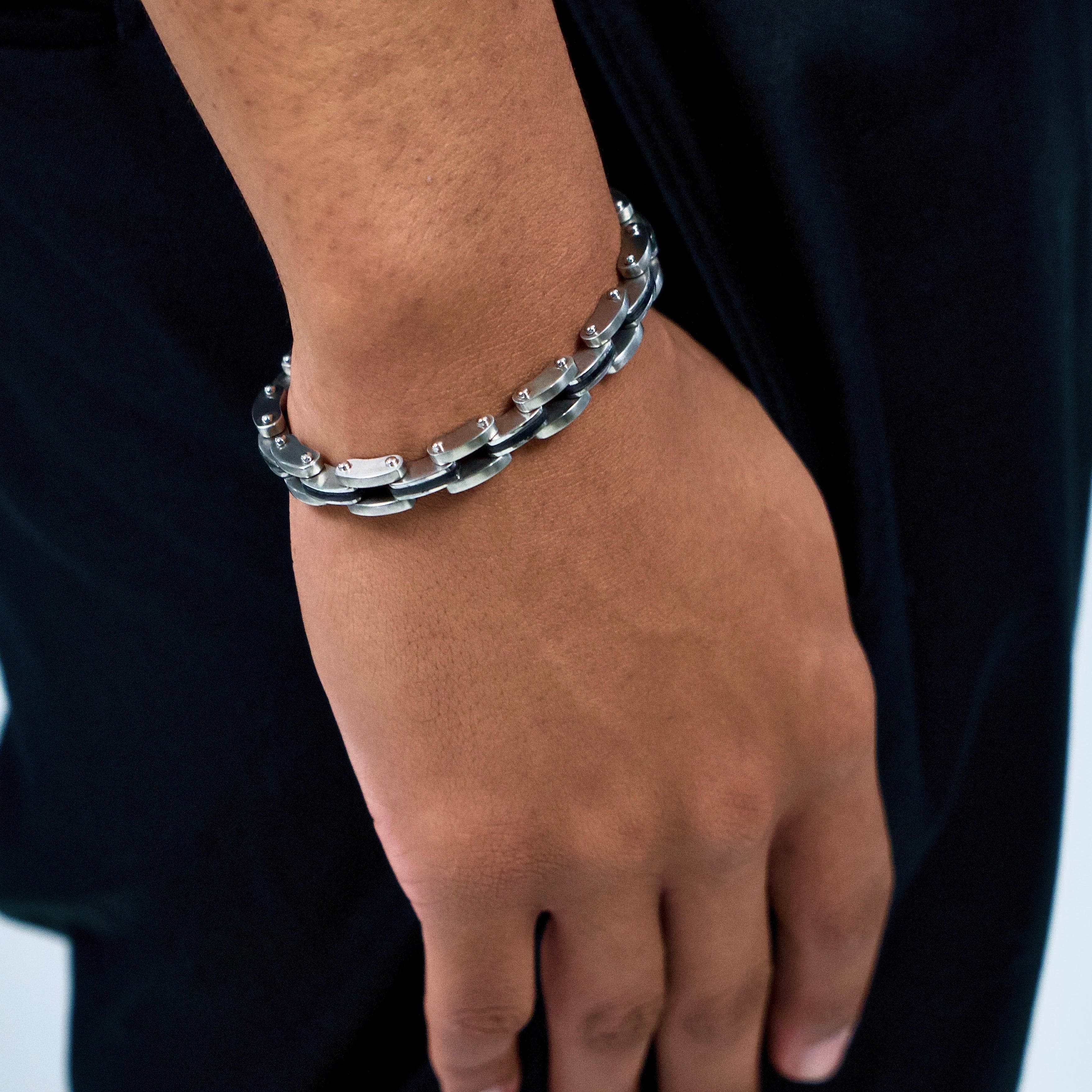 This is a closeup shot of our havoc bike chain bracelet on a models wrist